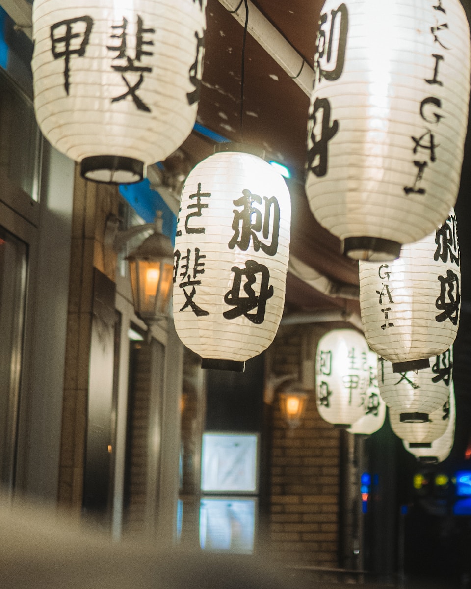 chinese lanterns hanging from the ceiling of a restaurant